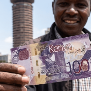 close up of man holding foreign currency
