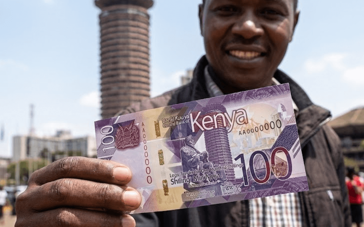 close up of man holding foreign currency