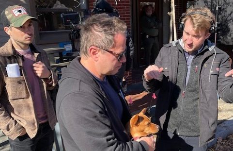 Director David Lipper (center) talks with members of his crew on the set of The Twelve Dates of Christmas in Clinton's Olde Towne on December 19.