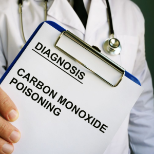 doctor holding clipboard with coarbon monoxide poisoning diagnosis