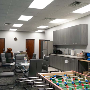 office lounge area with bar and game