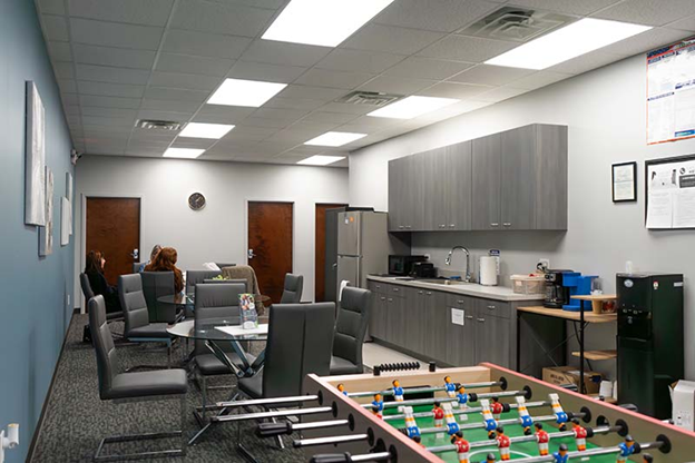 office lounge area with bar and game
