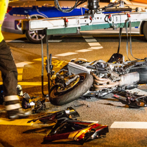 pieces of motorcycle on the roadway after an accident