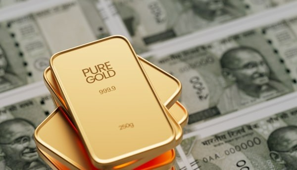 pure gold plates sitting on top of money