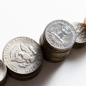 stacks of quarters, dimes, nickles, pennies and half dollars