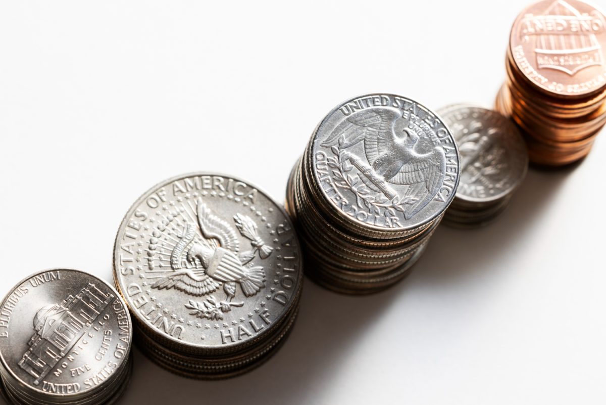 stacks of quarters, dimes, nickles, pennies and half dollars