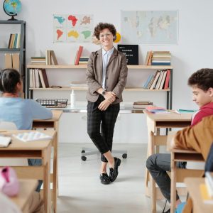 teacher standing in front of classroom with students