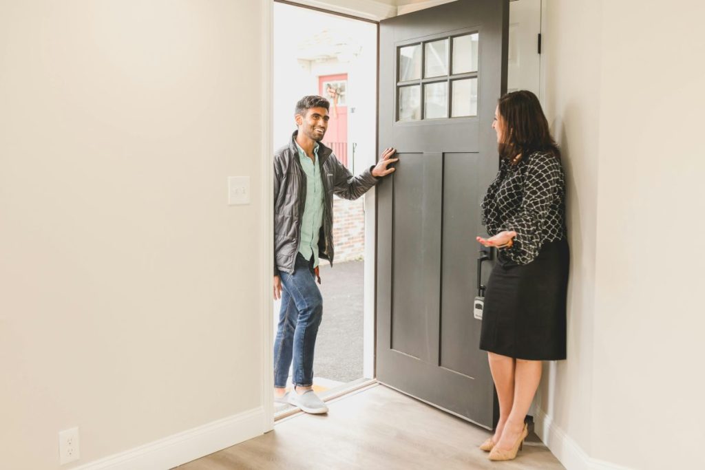 man walking through door to meet with a realtor