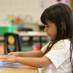 A Clinton Park student explores storytelling activities during class time.