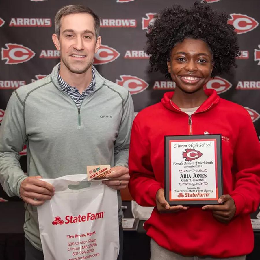 Aria Jones (right), was recently named a Clinton High School Athlete of the Month. Pictured with Jones is State Farm agent Tim Bruss (left), who sponsors the award. Jones is a Clinton High School girls basketball player.