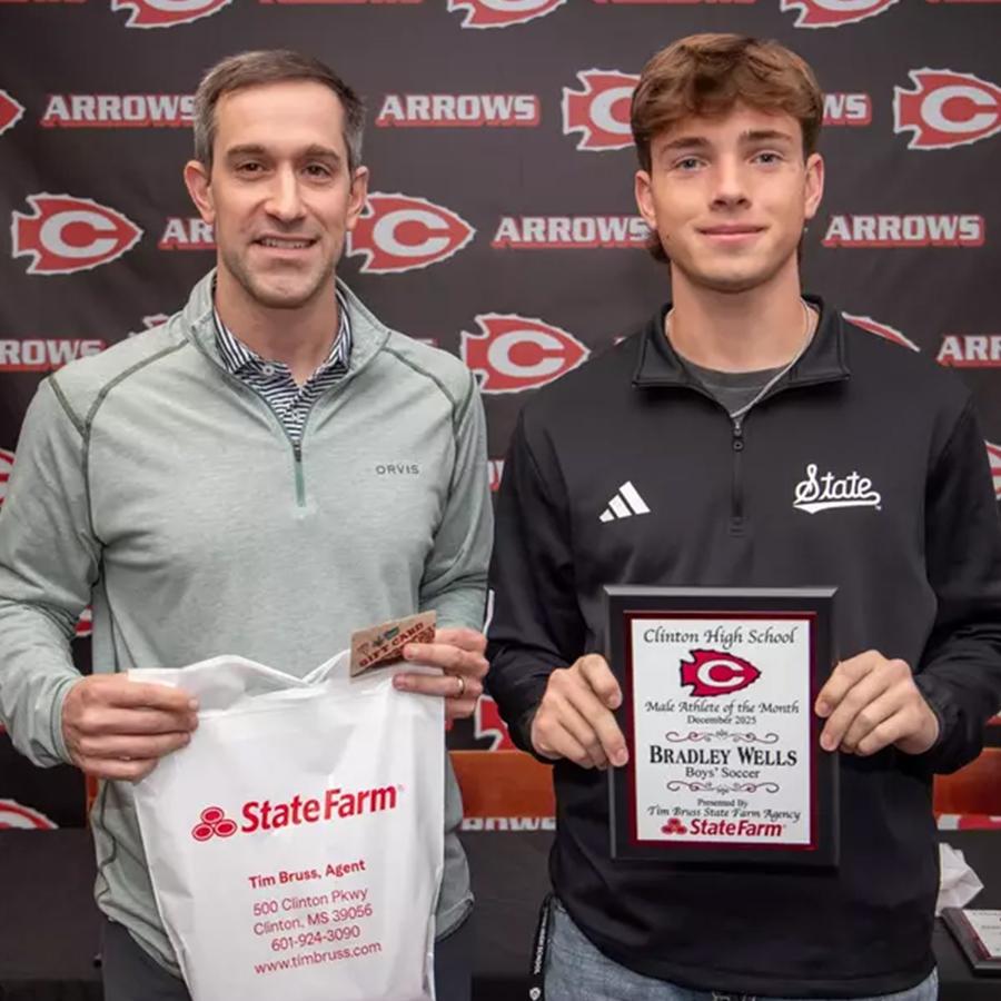 Bradley Wells (right), was recently named a Clinton High School Athlete of the Month. Pictured with Wells is State Farm agent Tim Bruss (left), who sponsors the award. Wells is a Clinton High School boys soccer player.