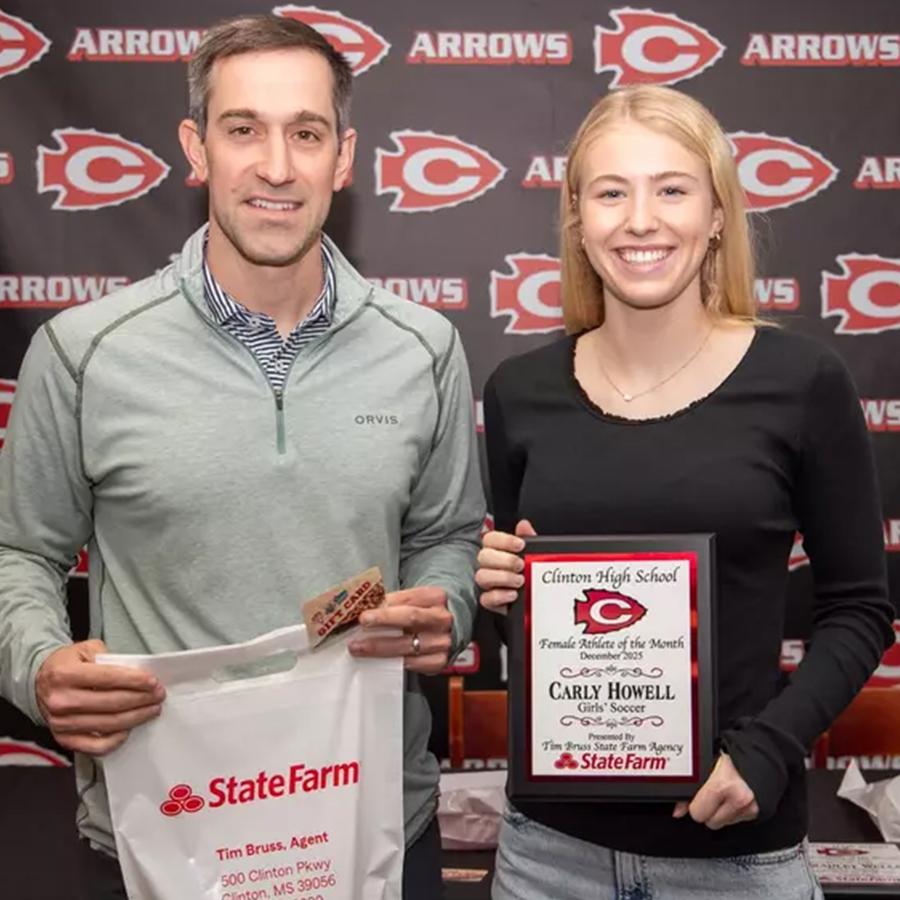 Carley Howell (right), was recently named a Clinton High School Athlete of the Month. Pictured with Howell is State Farm agent Tim Bruss (left), who sponsors the award. Howell is a Clinton High School girls soccer player.
