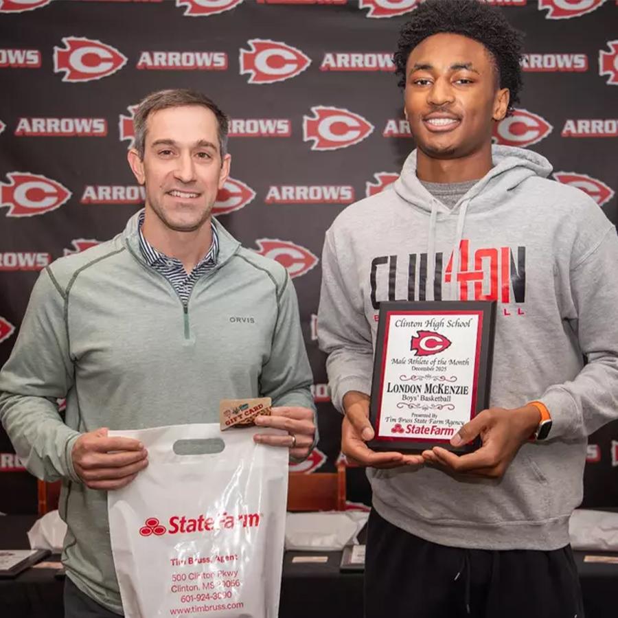 London Mckenzie (right), was recently named a Clinton High School Athlete of the Month. Pictured with Mckenzie is State Farm agent Tim Bruss (left), who sponsors the award. Mckenzie is a Clinton High School boys basketball player.