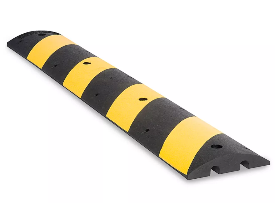 Pictured is a 2” tall speed bump sold by ULINE, shown for example purposes only.
