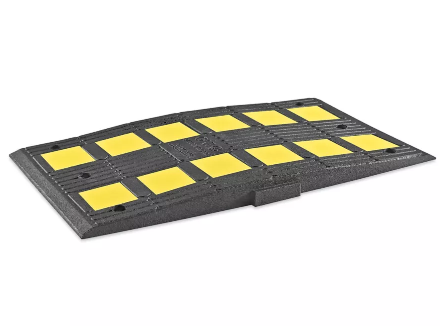 Pictured is a 2” tall speed hump sold by ULINE, shown for example purposes only.