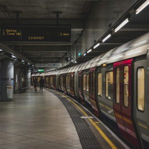 person standing near a train underground