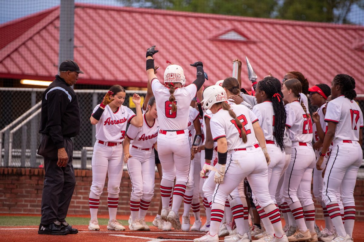 lady arrows softball celebrate at home base after no-hitter