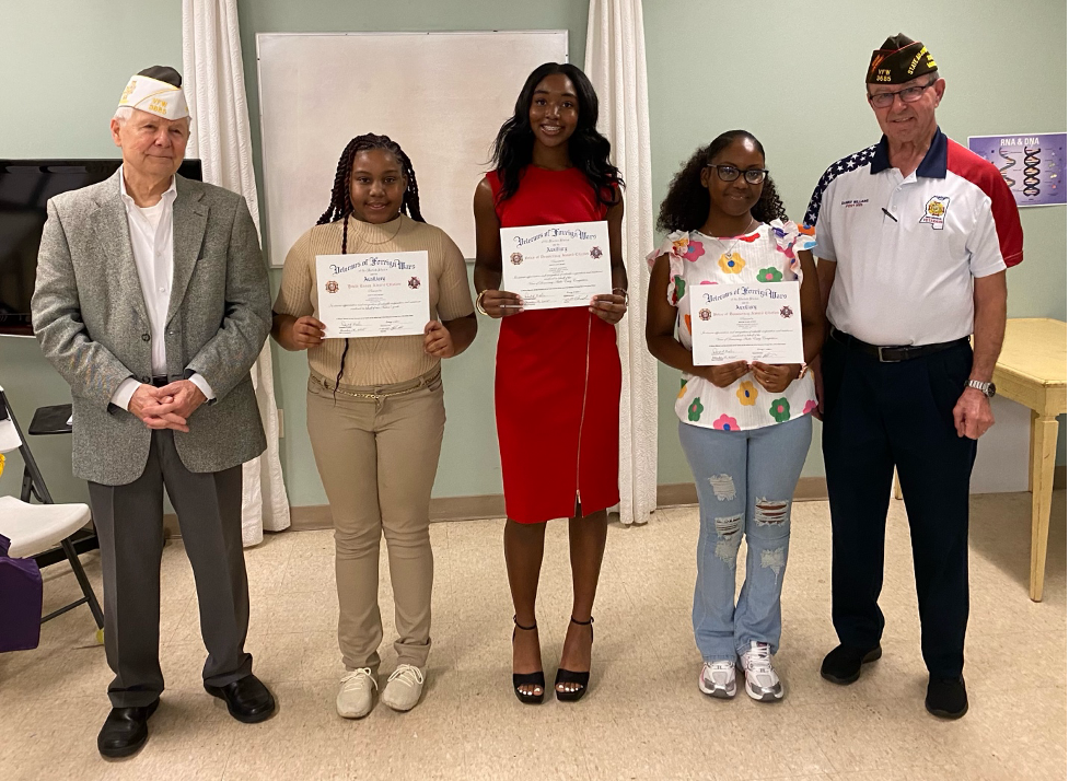 Pictured (l to r) are Post Commander Don Malin, Harmoni M. Ray, Kacey K. Gladney of Clinton, Englin-Amari Conrod, and Post Quartermaster Danny Williams.
