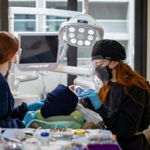 dental patient in chair getting surgical implants