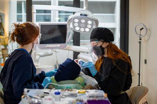 dental patient in chair getting surgical implants