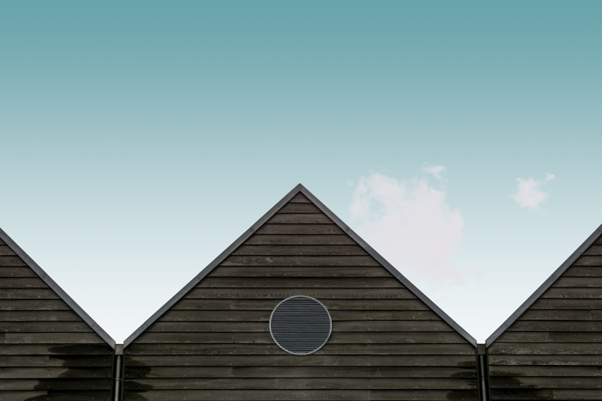 roof peak of house with teal sky