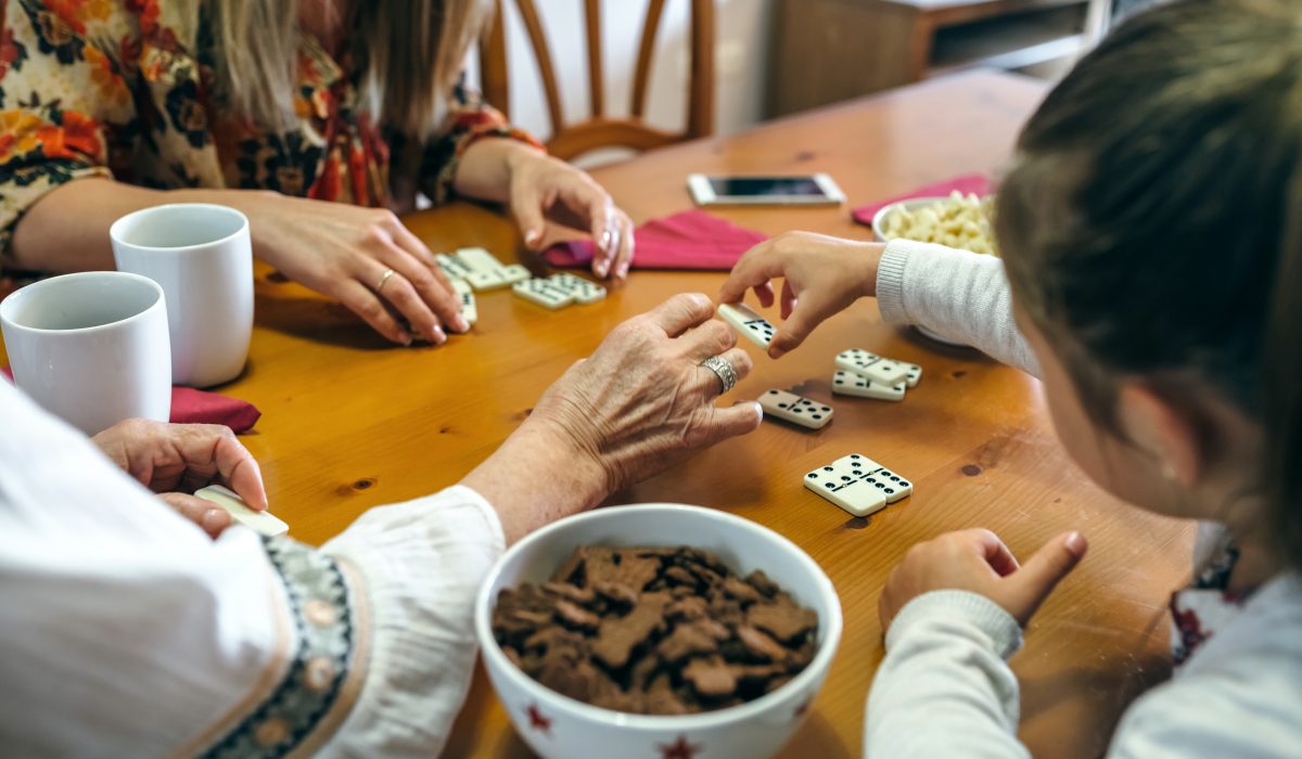 senior monther and daughter playing dominoes