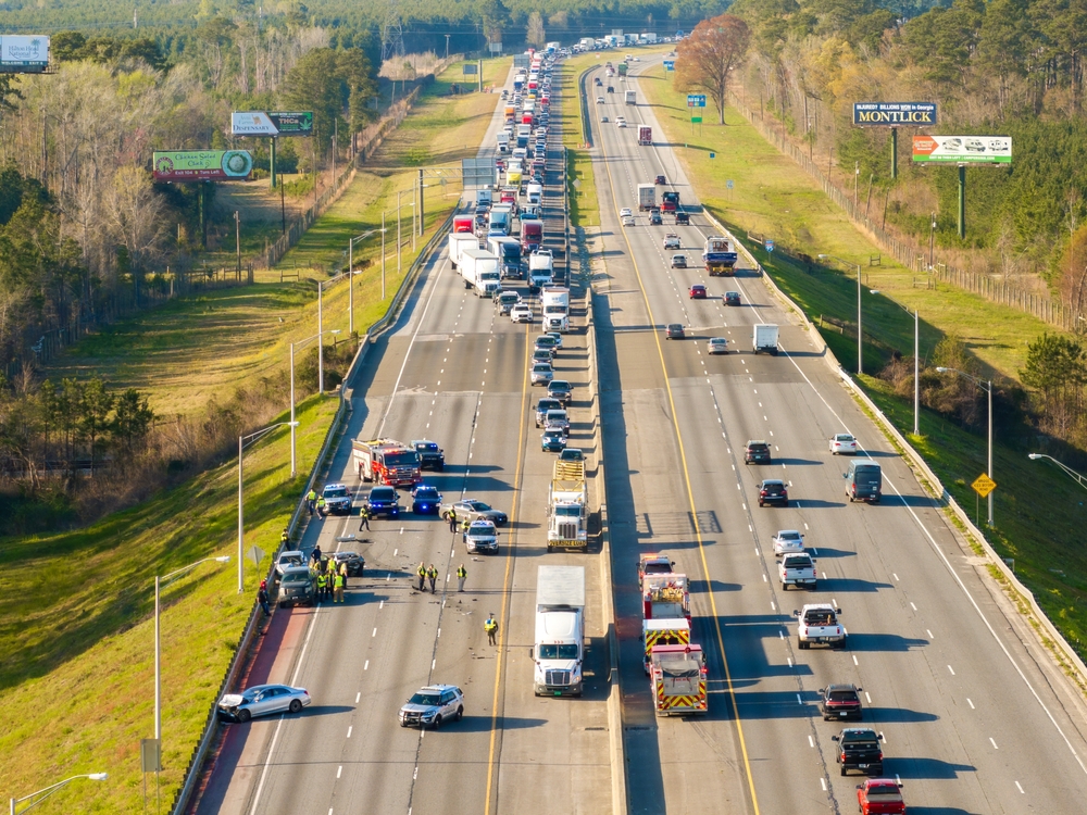 overview of wreck on highway with traffic stopped