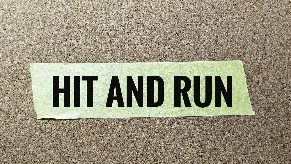 hit and run text on green tape on bulletin board