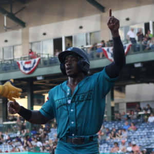 mud monster baseball player celebrates