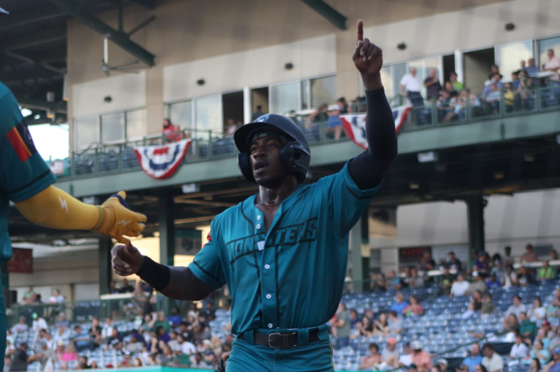 mud monster baseball player celebrates
