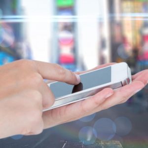 person holding iphone in palm of hand