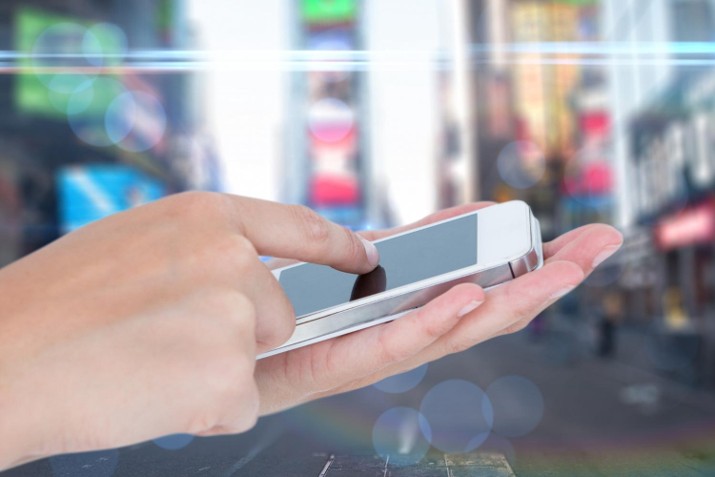person holding iphone in palm of hand