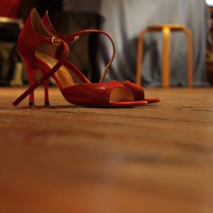 red high heels dancing shoes for women sitting on floor