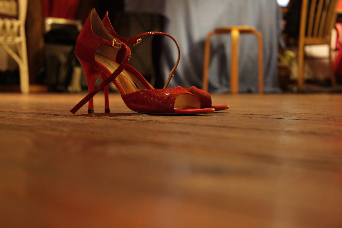red high heels dancing shoes for women sitting on floor