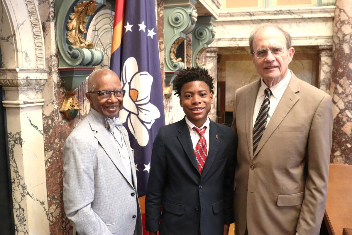 Collins S. Grady (center)
