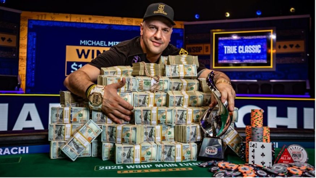 Michael "The Grinder" Mizrachi laying on money