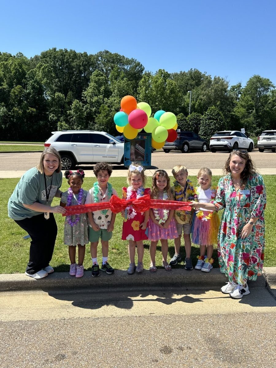 Pictured (l to r) with the new Clinton Park Sharing Library are librarian Haley Carr, Braesei Green, Noah Dourado, Sawyer James Rigney, Collins Tadlock, Graham Fulton, Micah Wade and Clinton Park Assistant Principal Summer Rigney.