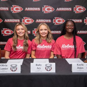 Pictured (l to r) are Olivia Lamier, Ruby Acy and Kayla Jones celebrating their recent commitment to the Holmes Community College women’s soccer team. Acy and Jones both will compete for the Bulldogs on the field, while Lamier will continue her involvement in the sport as a team manager.