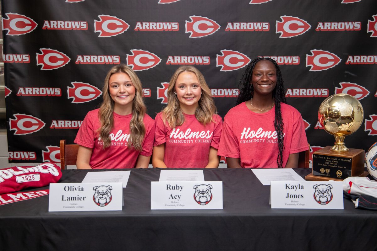 Pictured (l to r) are Olivia Lamier, Ruby Acy and Kayla Jones celebrating their recent commitment to the Holmes Community College women’s soccer team. Acy and Jones both will compete for the Bulldogs on the field, while Lamier will continue her involvement in the sport as a team manager.