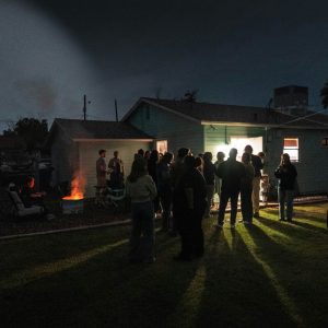 people gathered around a bonfire