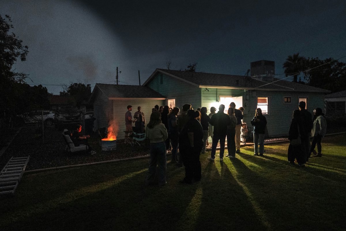 people gathered around a bonfire