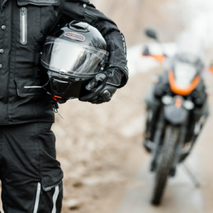 man holding a motorcycle helmet