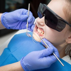 child getting teeth cleaned at dentist