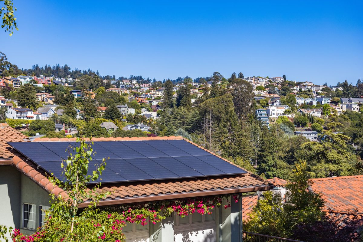 solar panels on rooftop of house in the hillside