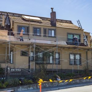roofers working on a family house