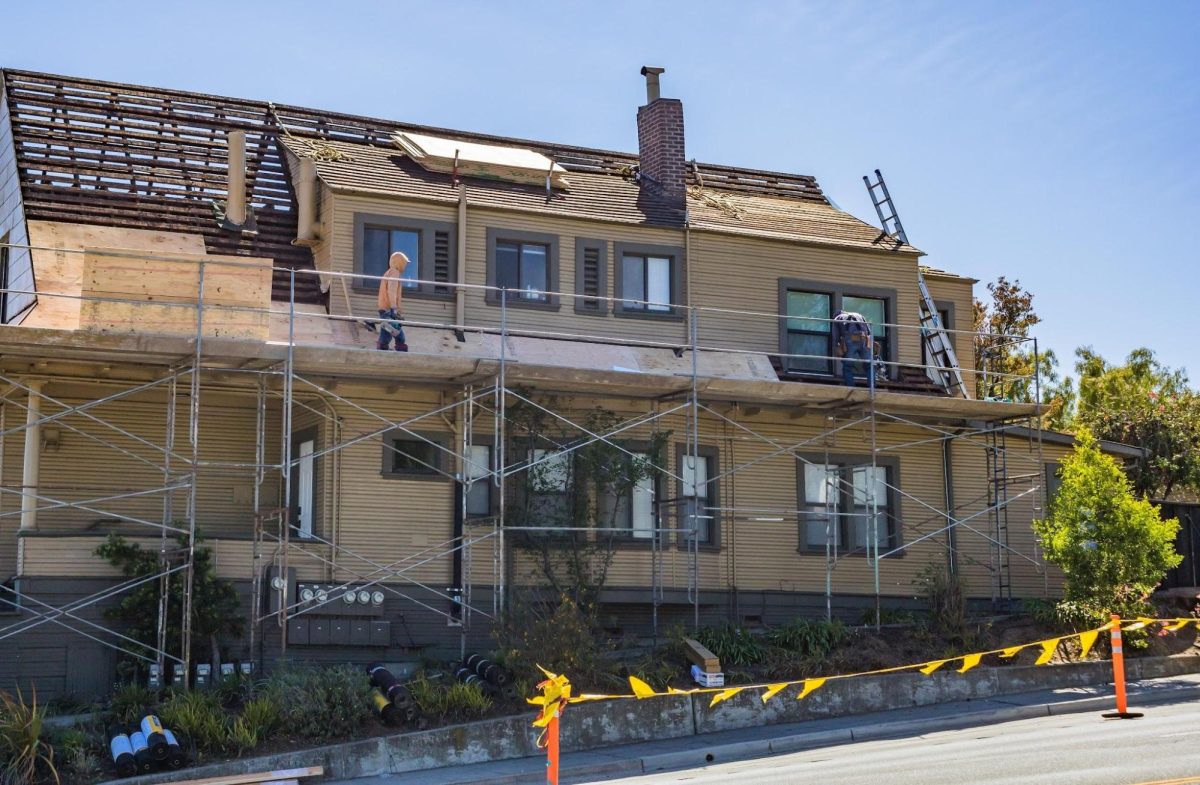 roofers working on a family house