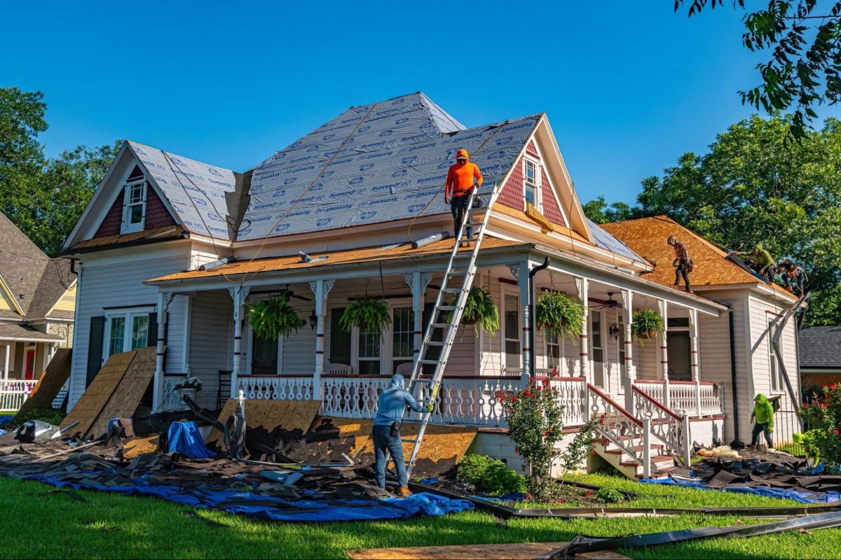 men working on a roof