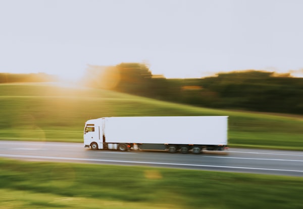 white box truck on open road