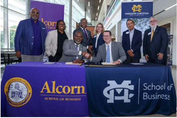Leaders from Alcorn State University and Mississippi Christian University gather following the June 30 signing of a Memorandum of Understanding establishing an accelerated 4+1 Master of Accountancy pathway between the two institutions. Seated, from left, Dr. Tracy M. Cook, president of Alcorn State University; and Dr. Blake Thompson, president of Mississippi Christian University, and standing from left, Dr. Edmund Buckner, ASU associate provost for research and innovation; LaTuesday Guy, ASU program coordinator; Dr. Antwon Woods, dean, ASU School of Business; Dr. Stephanie Busbea, MC interim provost; Dr. Marcelo Eduardo, dean, MC School of Business; and Dr. Billy Morehead, MC program coordinator.