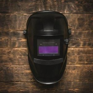 Welding helmet with purple welding lens